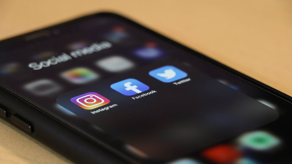 online marketing techniques like social media displayed on a phone