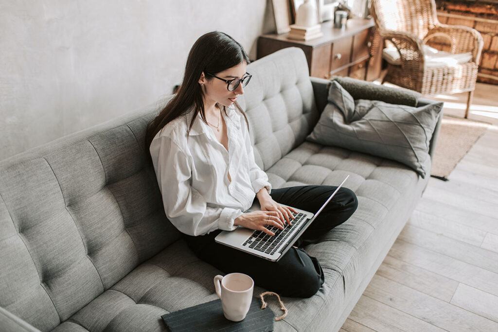 woman working at home using laptop to start an online business