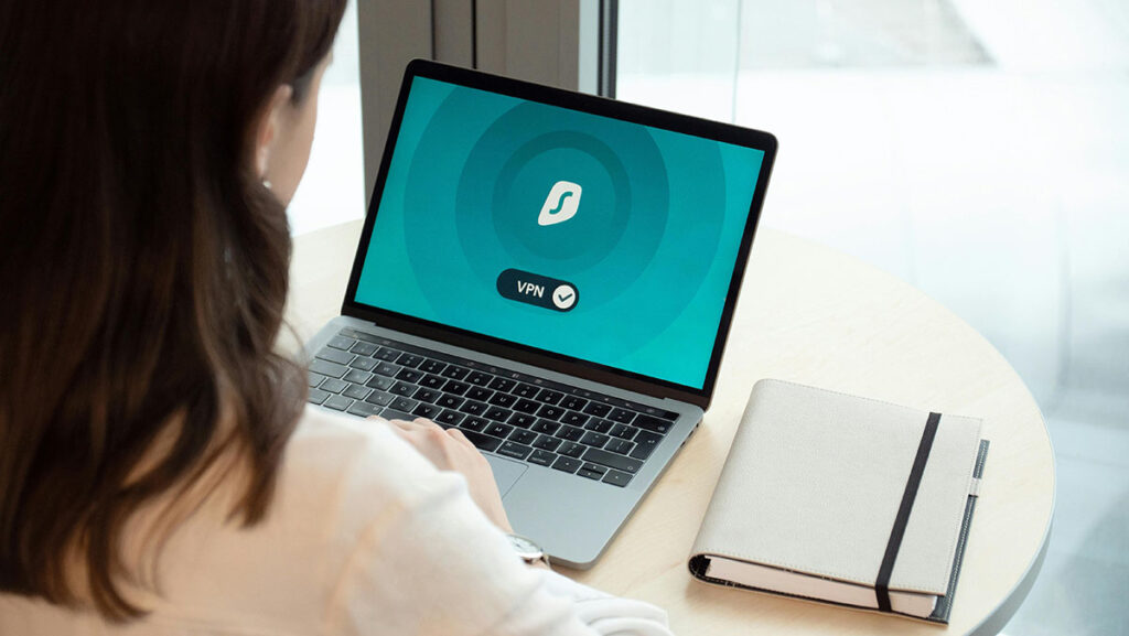 woman using a vpn on a laptop